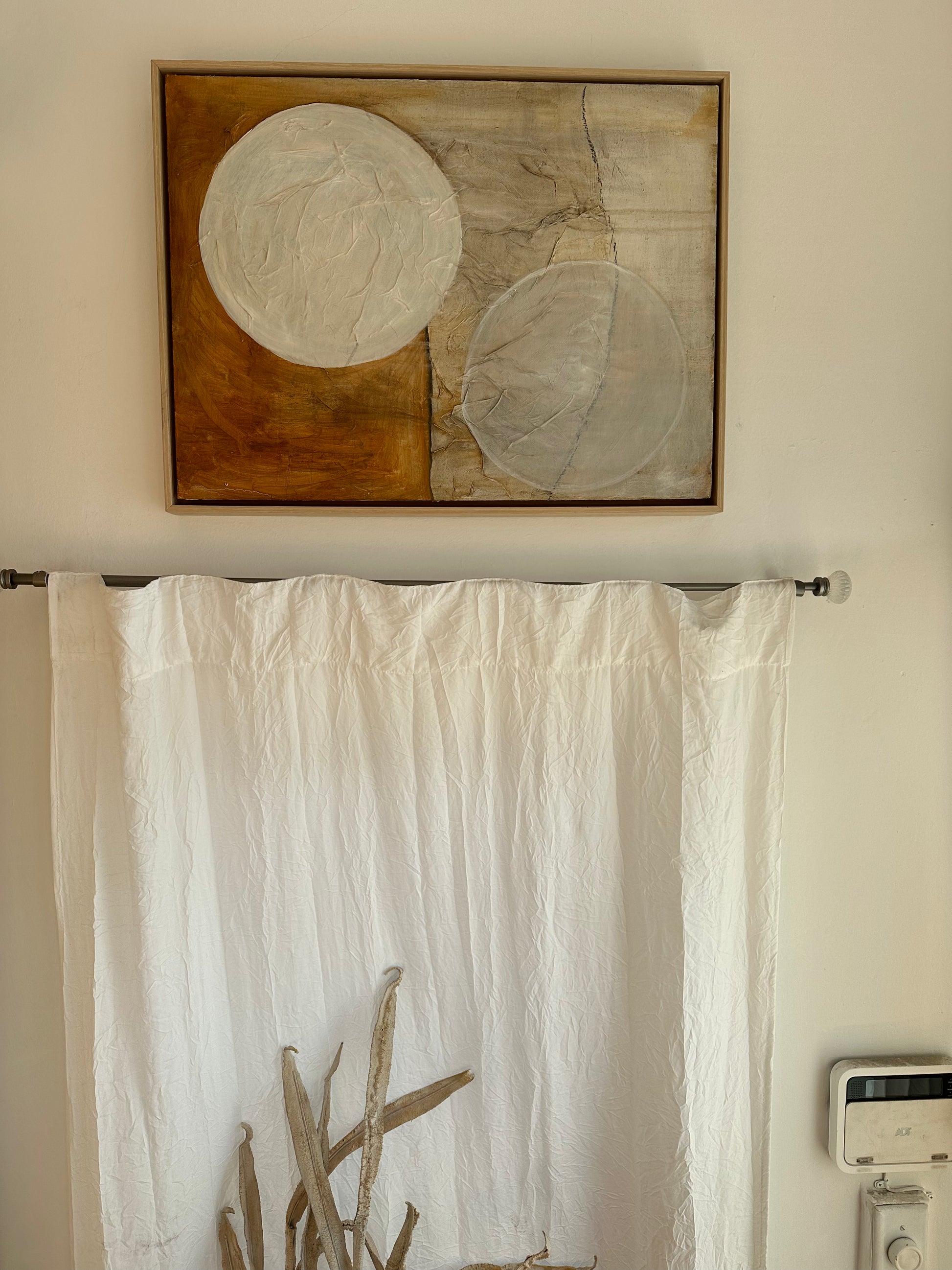 oil + paper on canvas in wood frame circles on orange