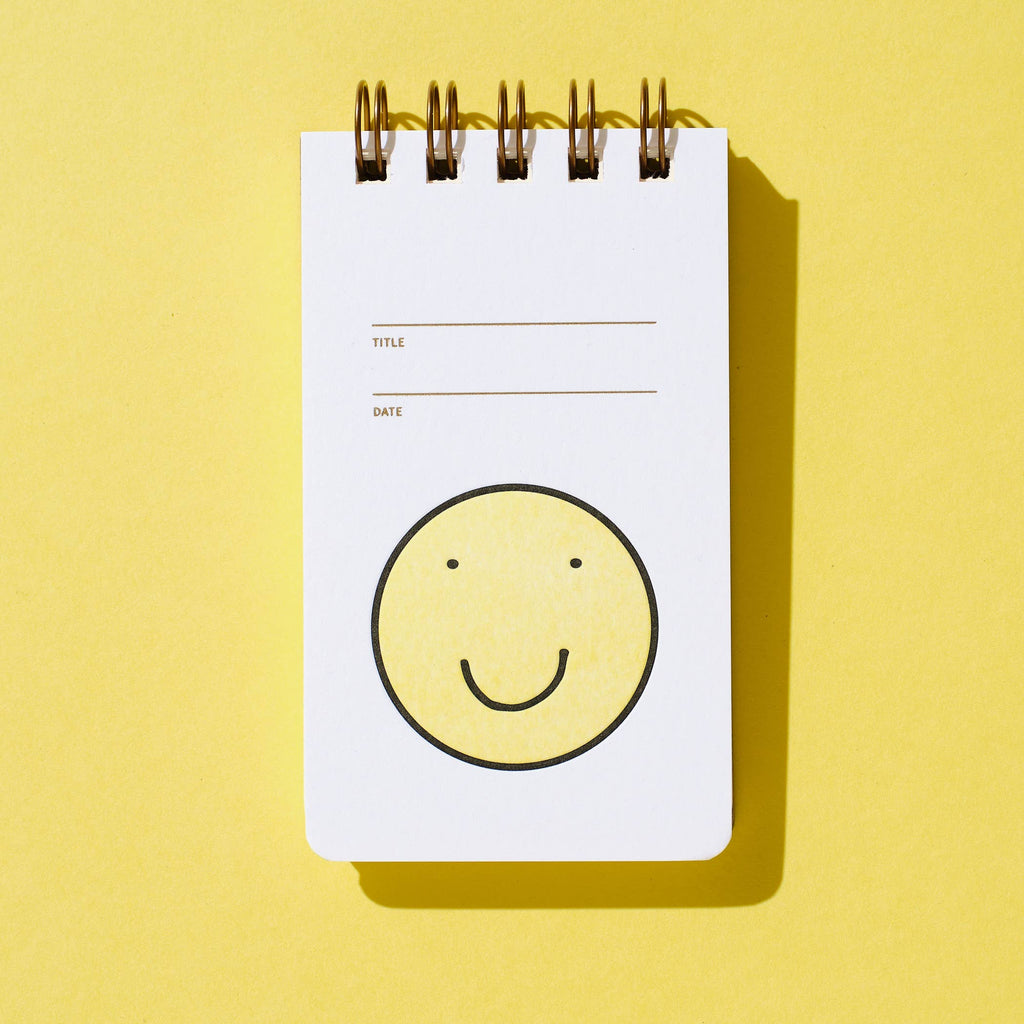 reporter notebook - smiley face