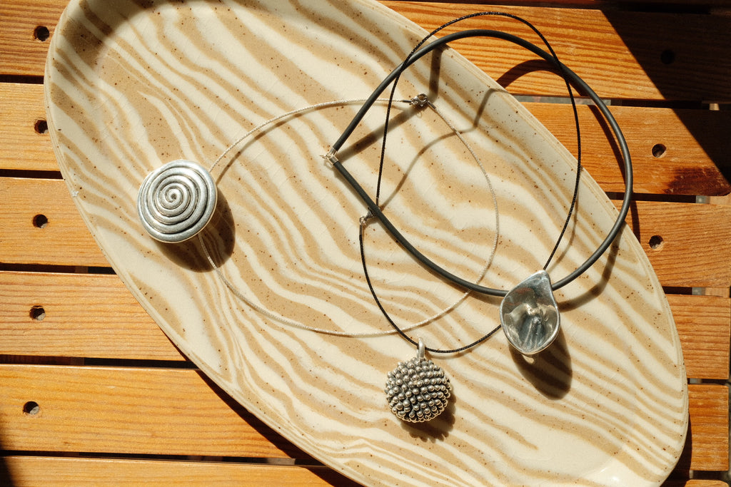 silver pom flower necklace