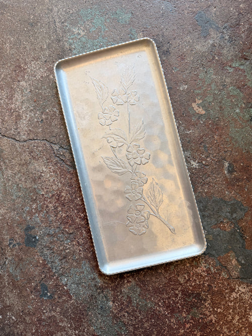 vintage metal dish with floral pattern
