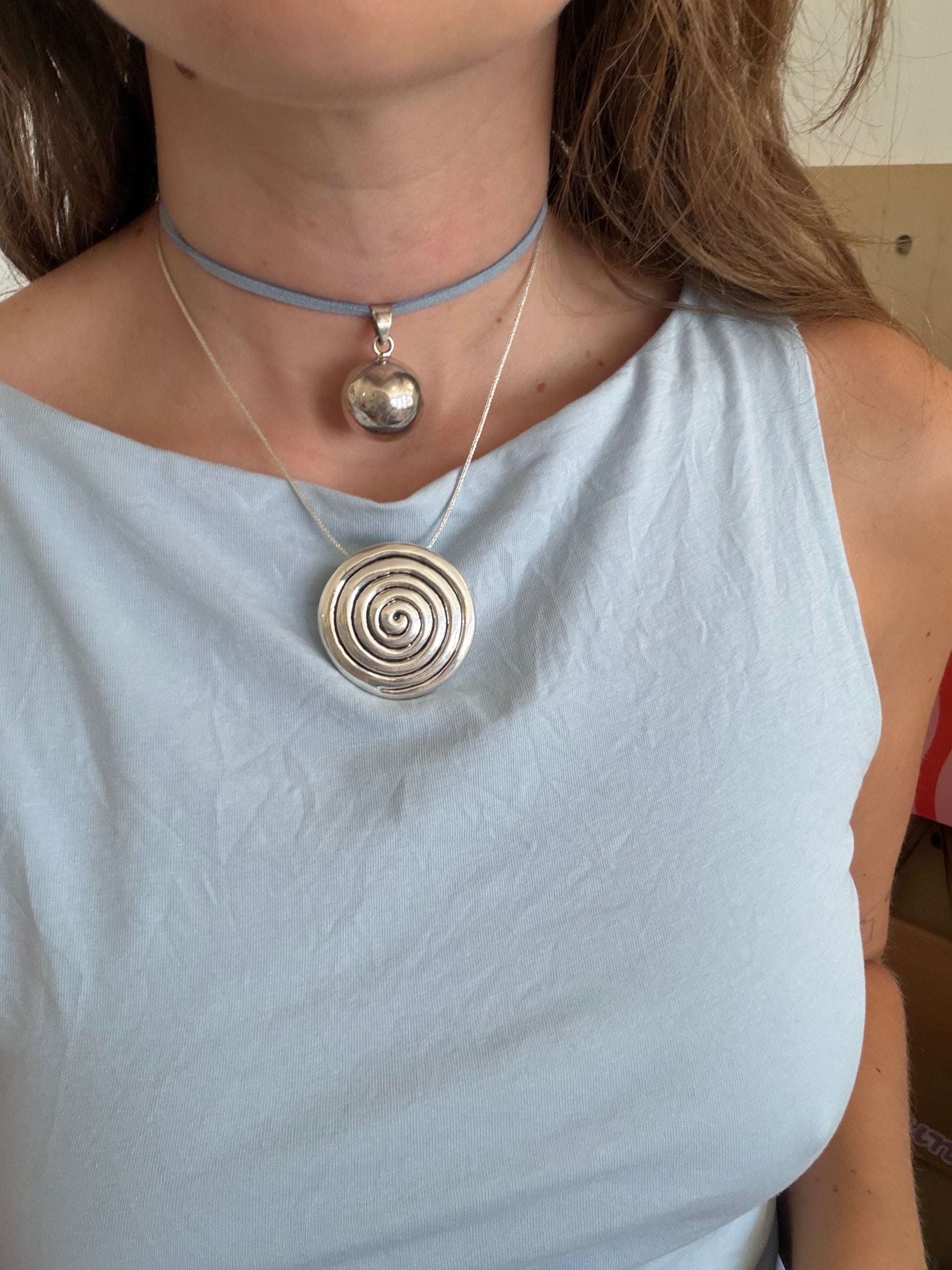 silver ball on cord