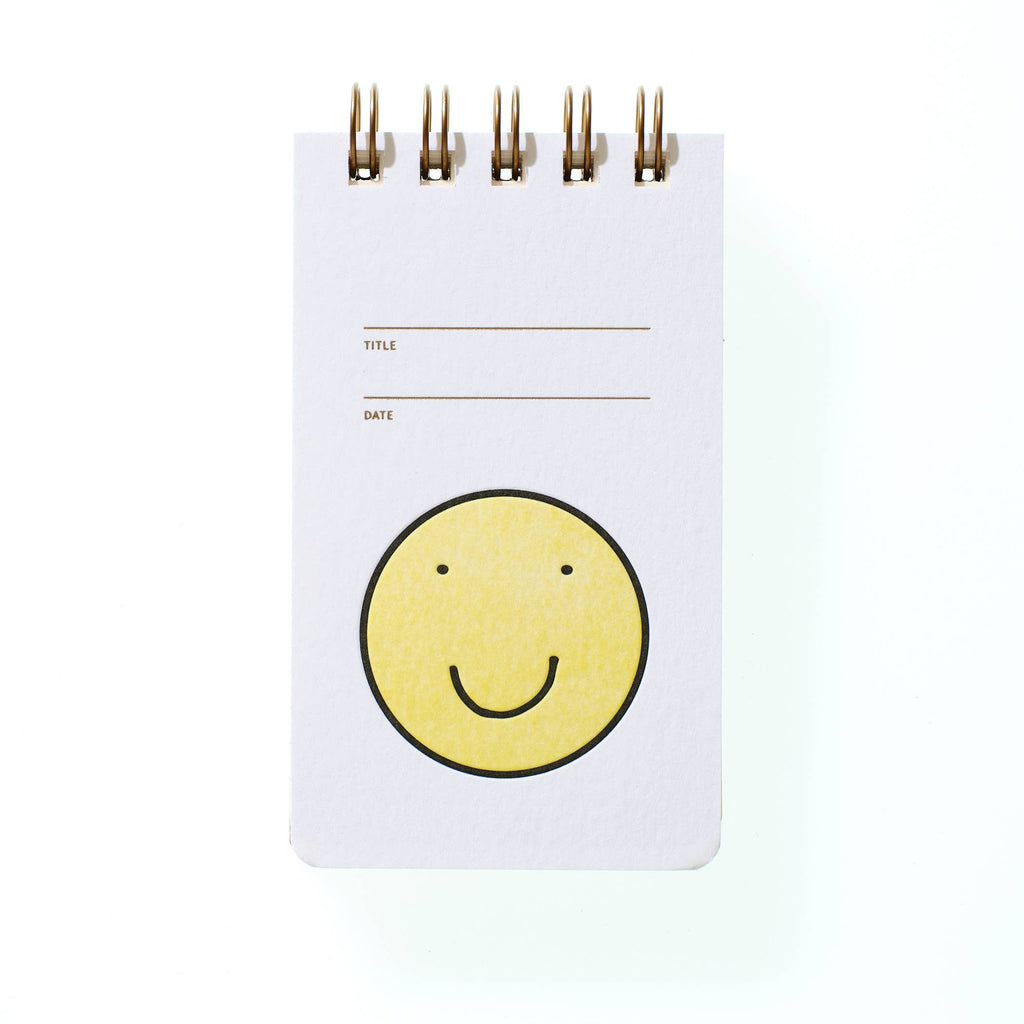 reporter notebook - smiley face