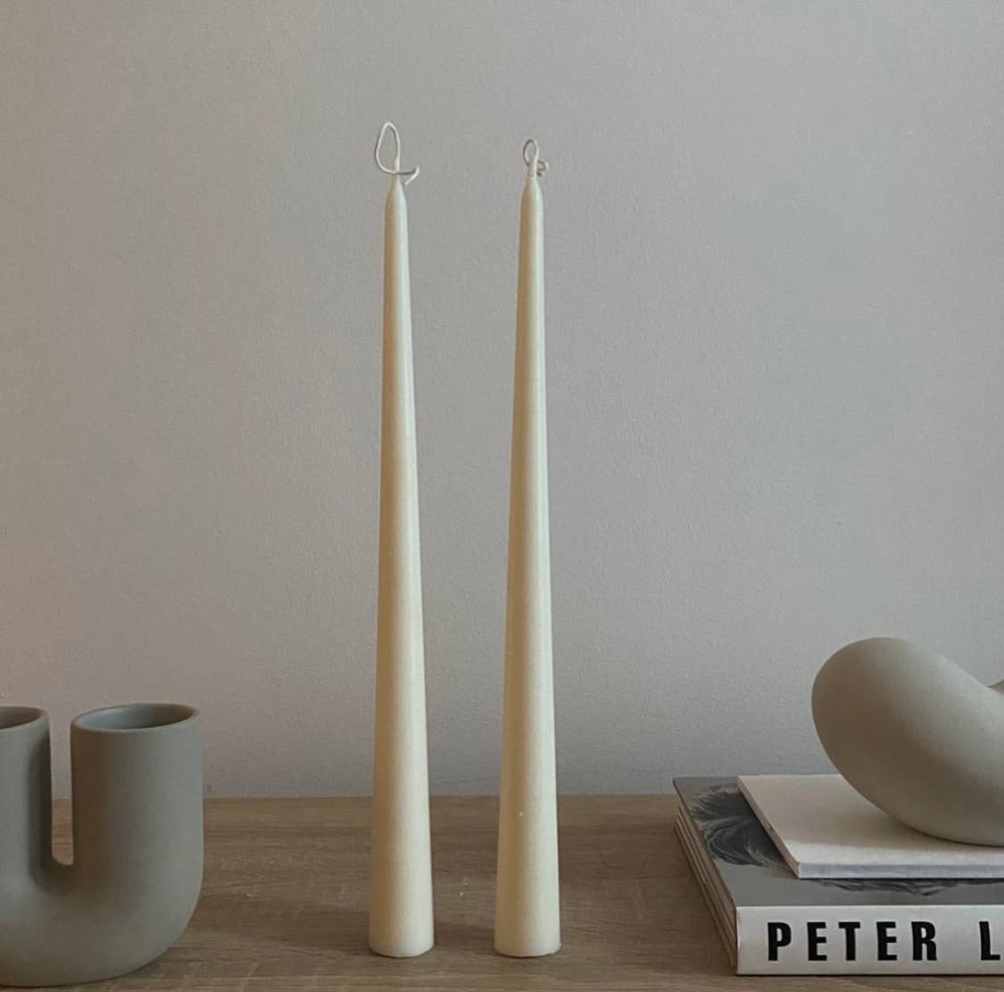 set of white tall tapered taper candles
